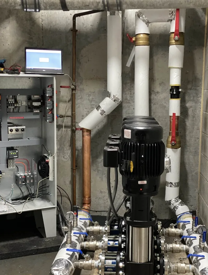 BMI technician commissioning a newly installed MEV meter efficiency valve on the incoming water main of a Toronto condominium