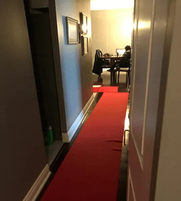 Floor protection laid from the suite door to the riser wall before BMI opens up