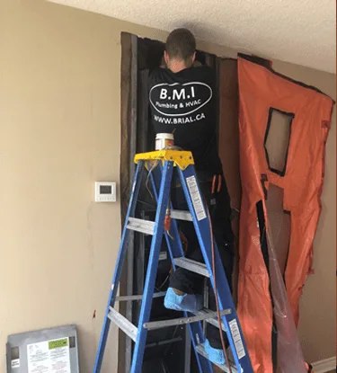 BMI plumber soldering a copper joint on a new condominium riser
